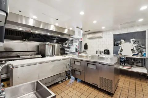 a kitchen with counter top space cabinets and stainless steel appliances