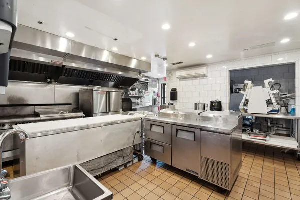 a kitchen with counter top space cabinets and stainless steel appliances