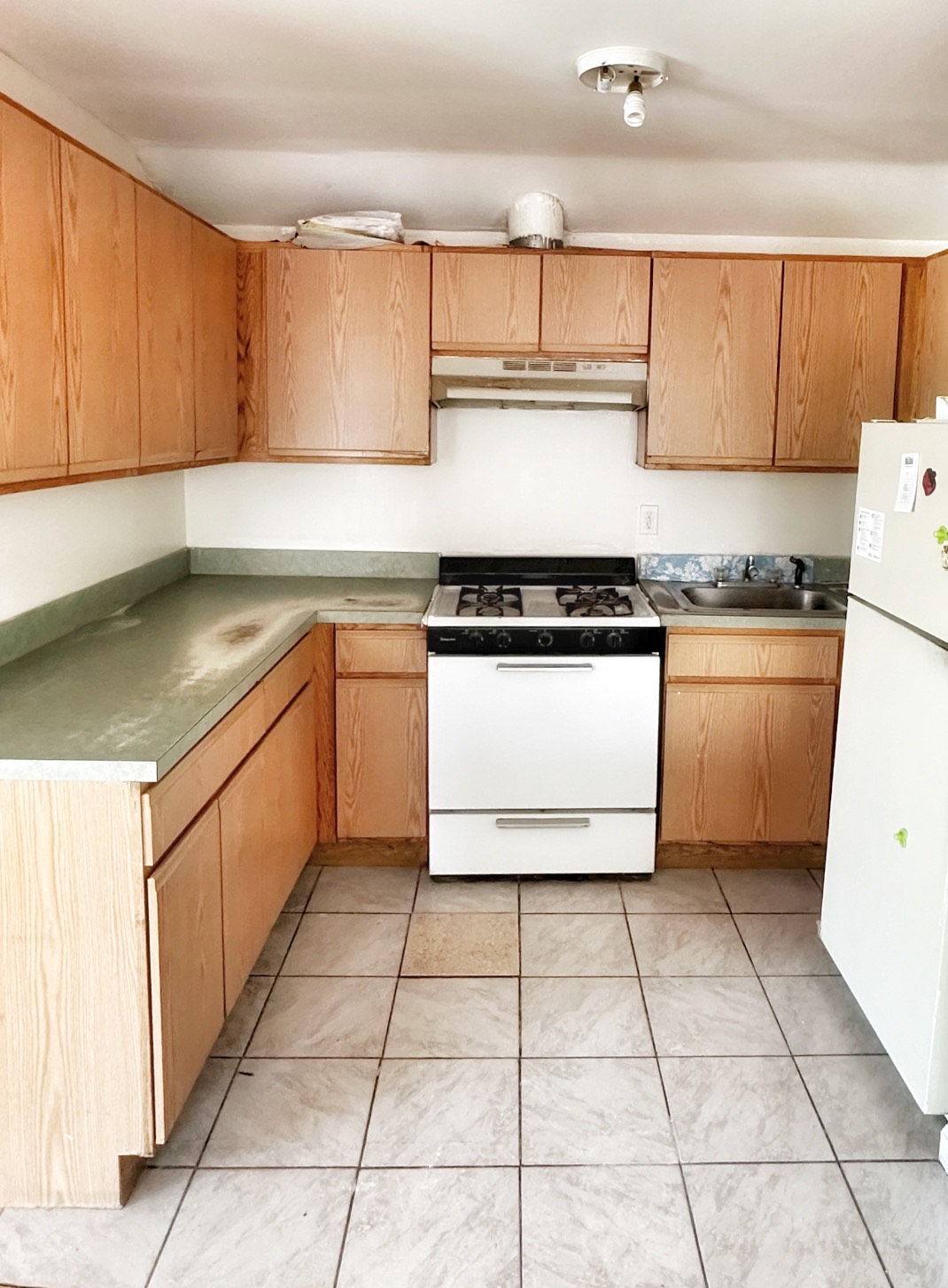 2130 Troy Avenue, Unit 2 Brooklyn, NY 11234 - Photo 2 of 4 a kitchen with stainless steel appliances granite countertop a stove a sink and a refrigerator