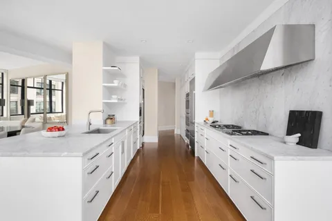 a kitchen with stove a sink and dishwasher