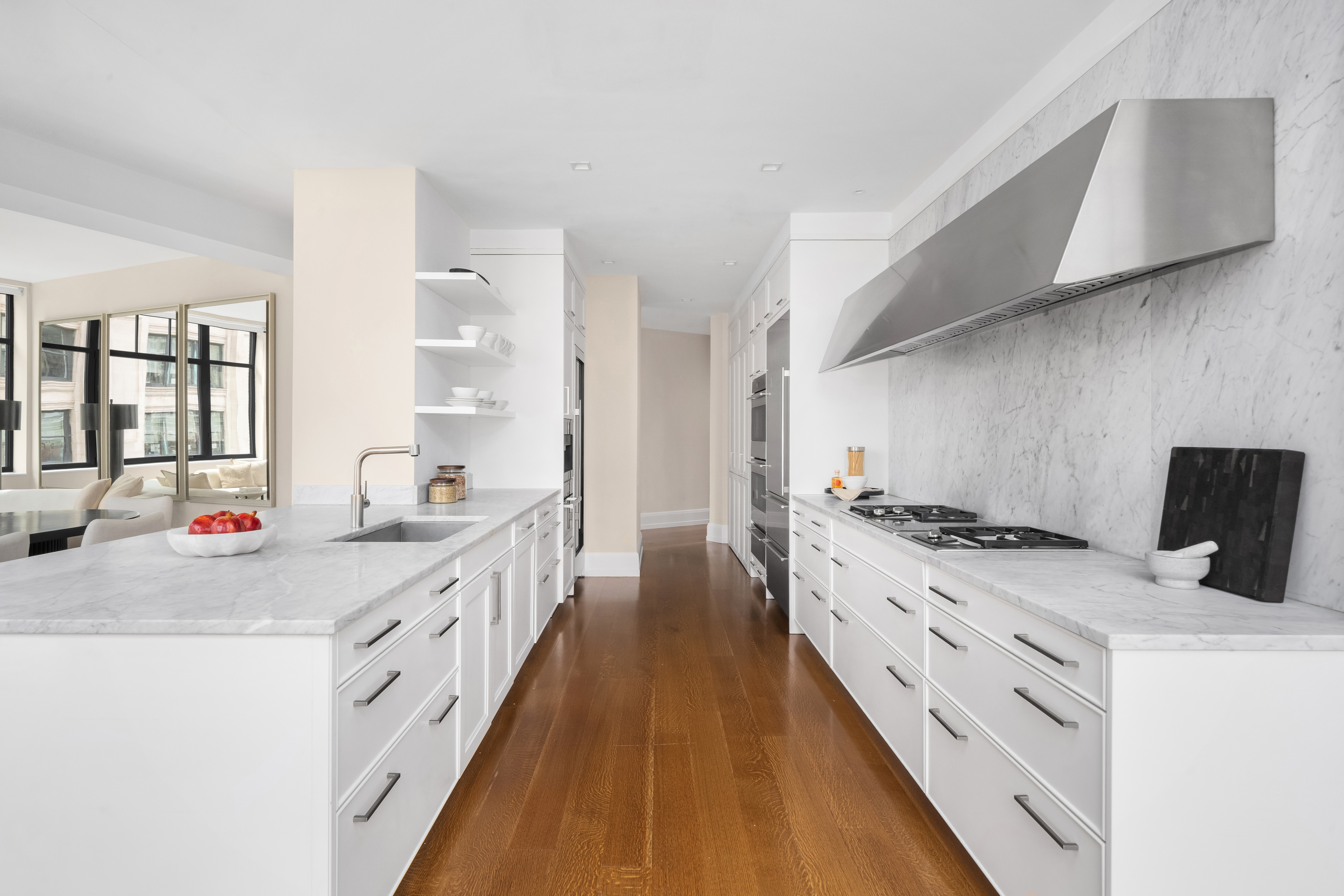 10 Madison Square West, Unit 12D Manhattan, NY 10010 - Photo 5 of 21 a kitchen with stove a sink and dishwasher