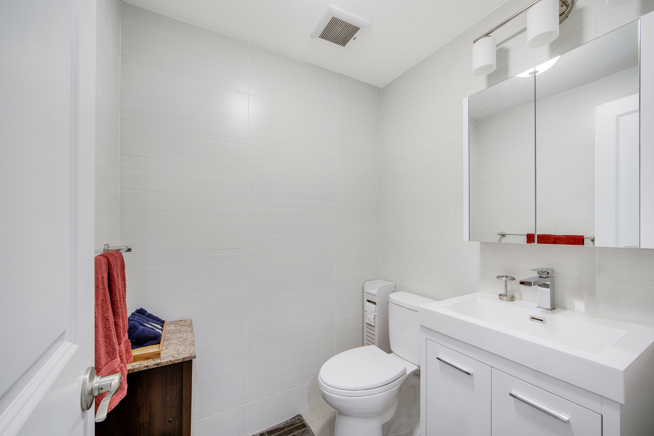 27-34 27th Street, Unit 1B Queens, NY 11102 - Photo 9 of 10 a bathroom with a sink toilet and vanity