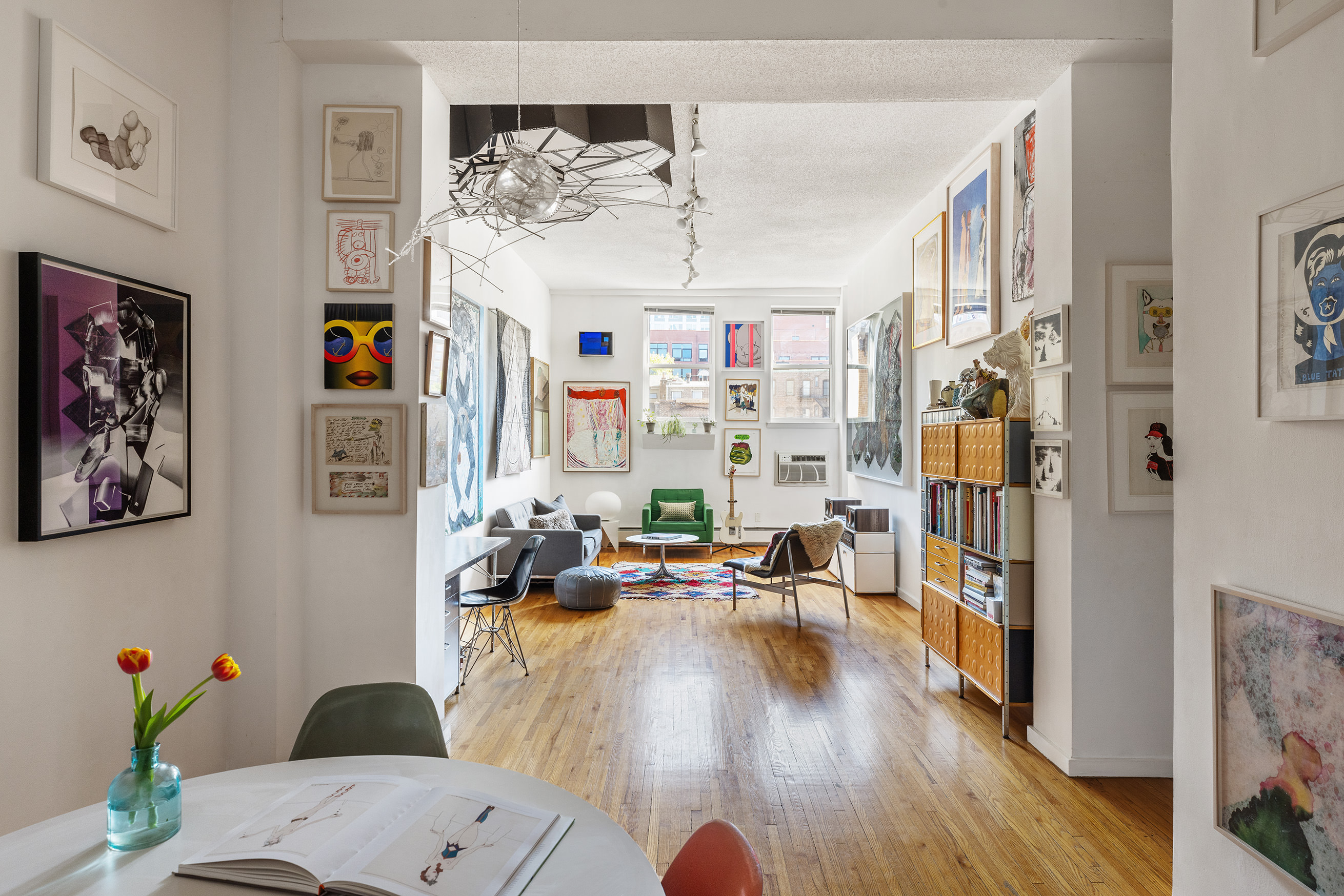 a living room with furniture and wooden floor
