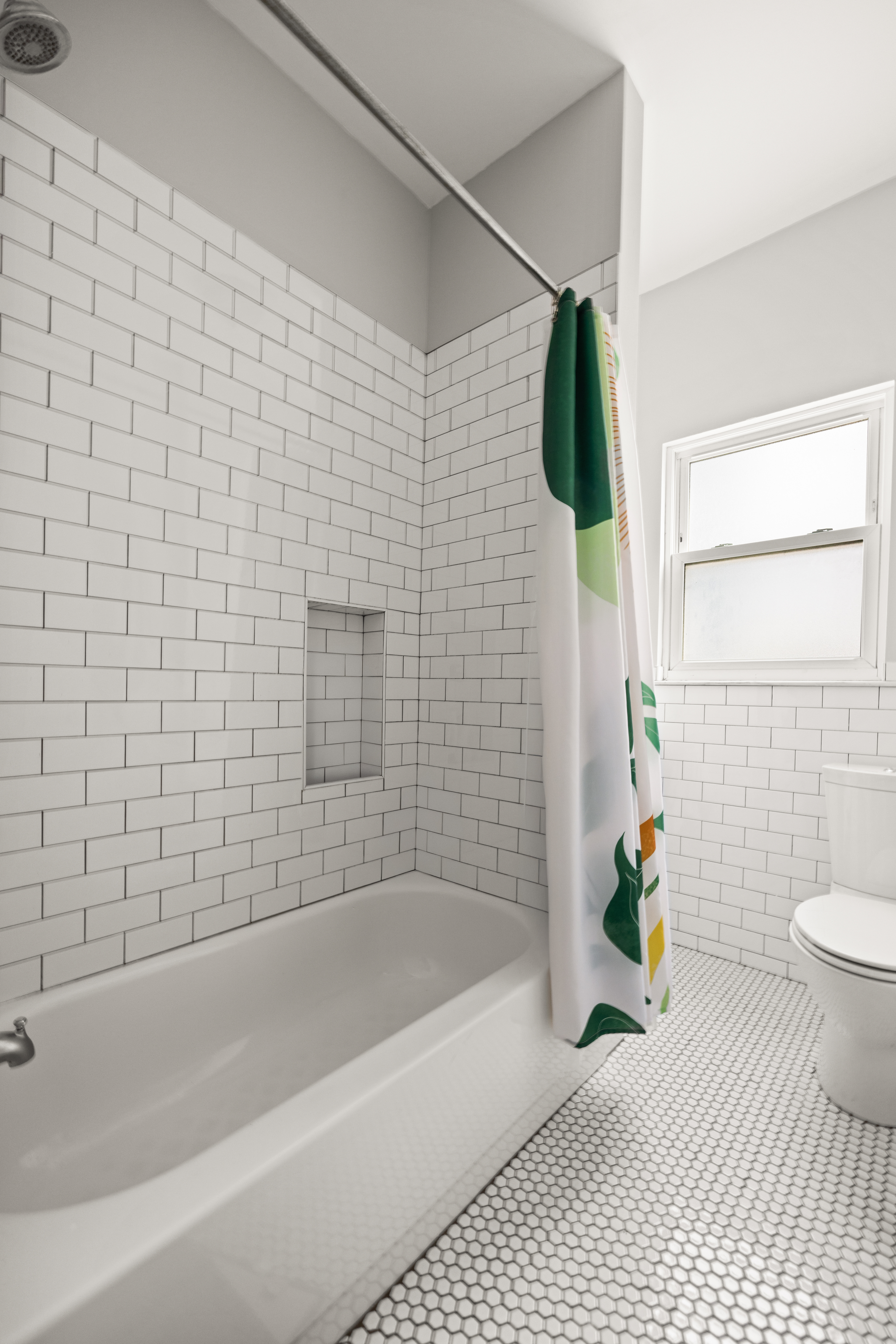 758 Westminster Road Brooklyn, NY 11230 - Photo 26 of 32 a bathroom with a bathtub and toilet