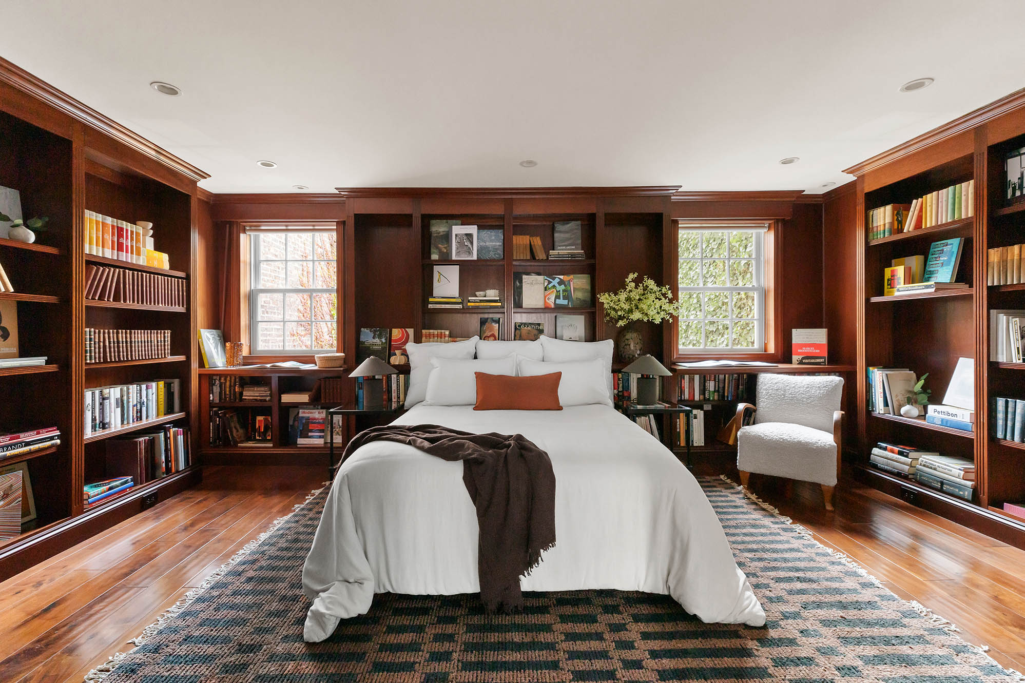 12 Leroy Street Manhattan, NY 10014 - Photo 12 of 20 a bed room with a bed and a book shelf