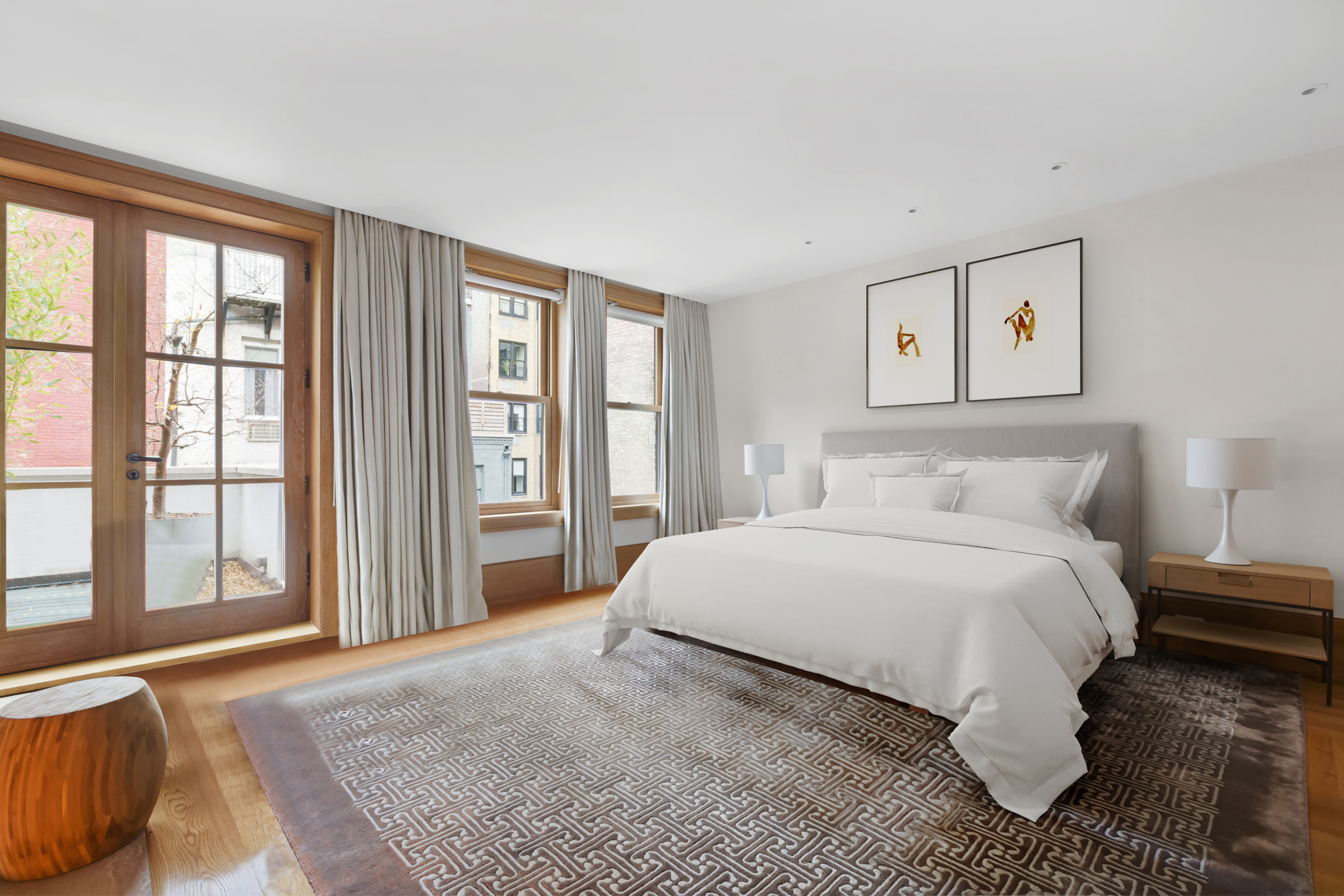 45 East 74th Street Manhattan, NY 10021 - Photo 17 of 33 a bedroom with a large bed and a large window