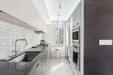 a kitchen with a refrigerator sink and stove