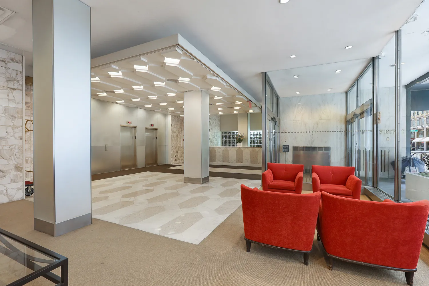 a living room with furniture and a large mirror