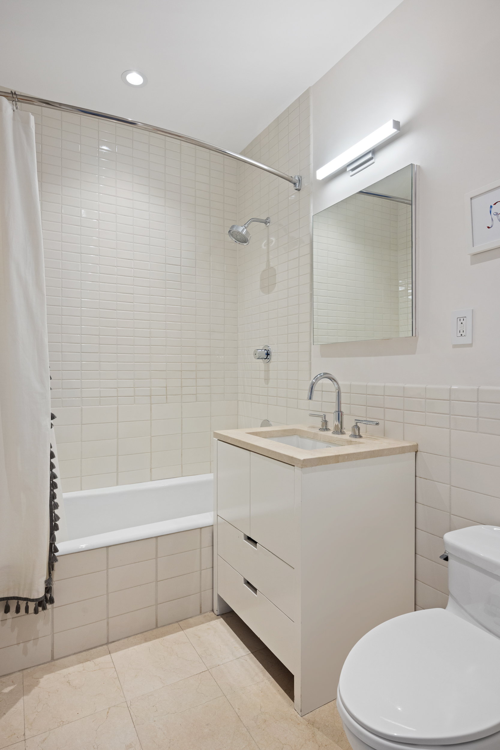 415 Greenwich Street, Unit 5D Manhattan, NY 10013 - Photo 10 of 16 a bathroom with a sink a toilet and shower