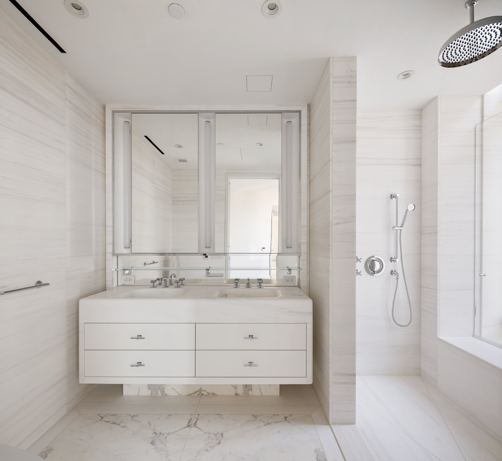 430 East 58th Street, Unit 39A Manhattan, NY 10022 - Photo 8 of 15 a bathroom with a double vanity sink mirror and shower