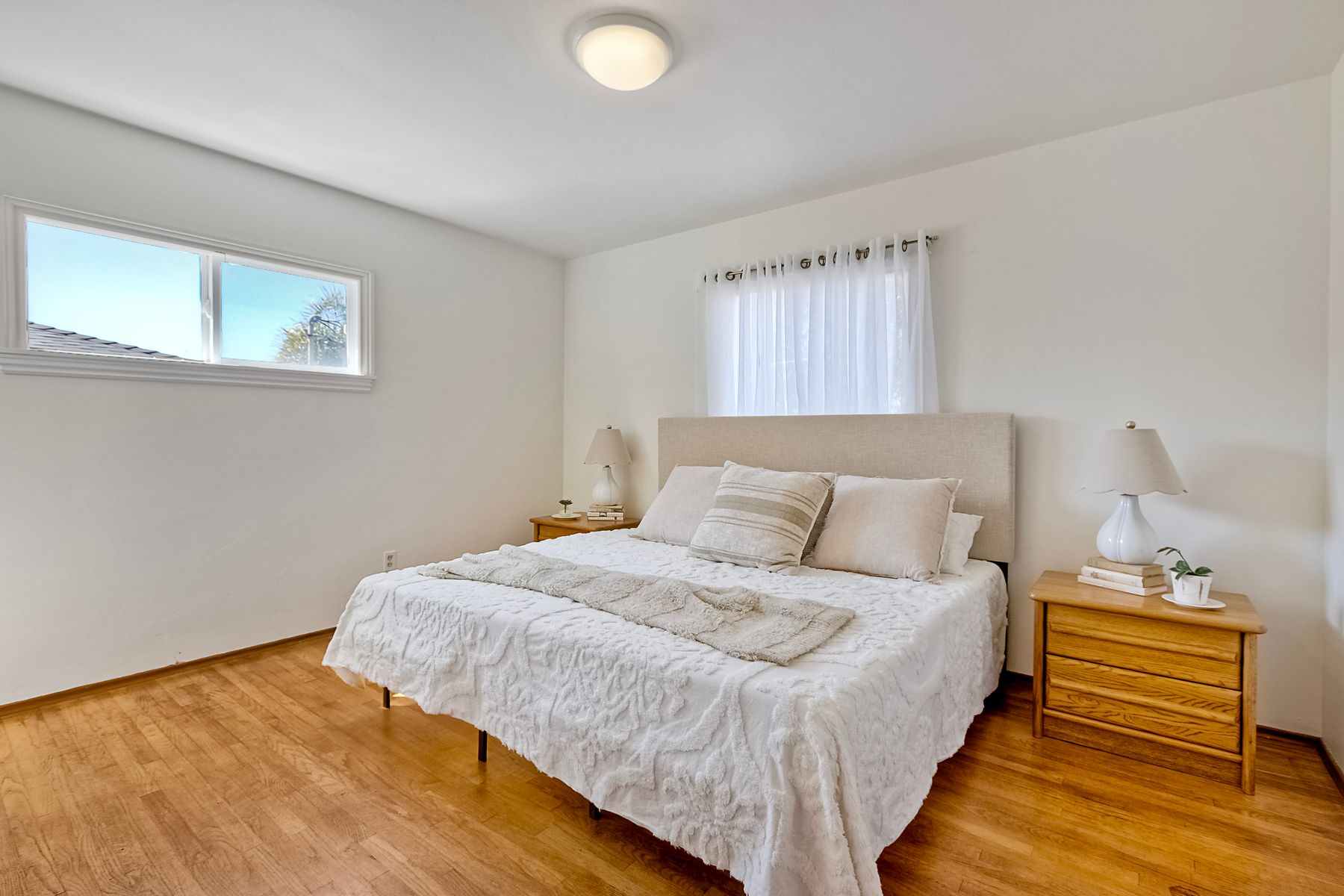 534 Hoover Street Oceanside, CA 92054 - Photo 18 of 31 a bedroom with a bed and a window