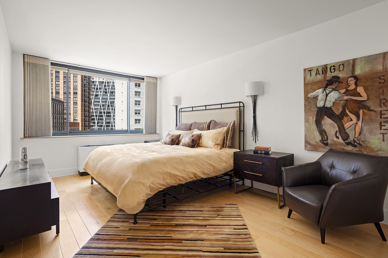 2000 Broadway, Unit 5I Manhattan, NY 10023 - Photo 4 of 9 a spacious bedroom with a bed and wooden floor