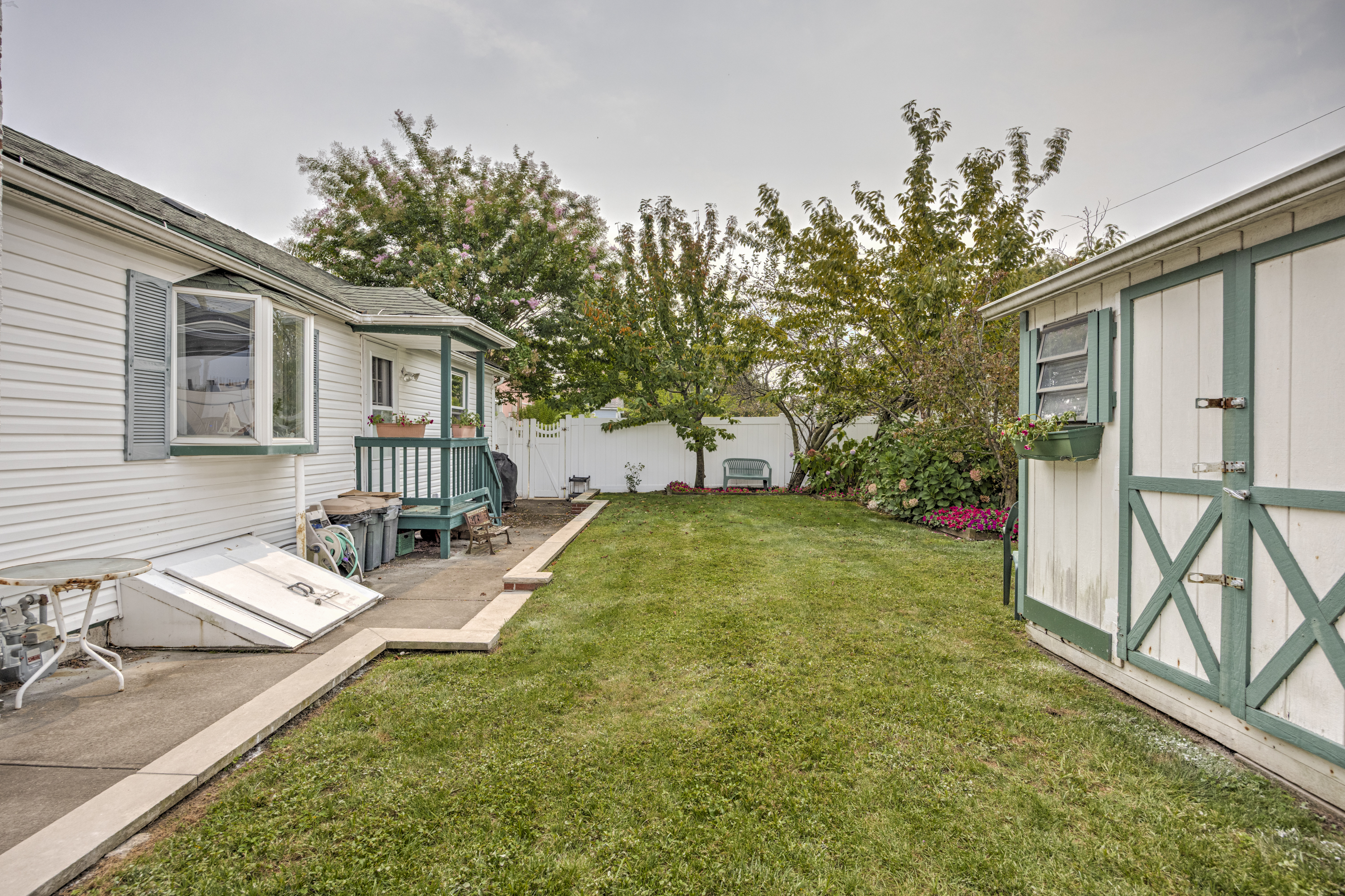 355 D Dormans Court Queens, NY 11693 - Photo 12 of 21 a view of a house with backyard and sitting area