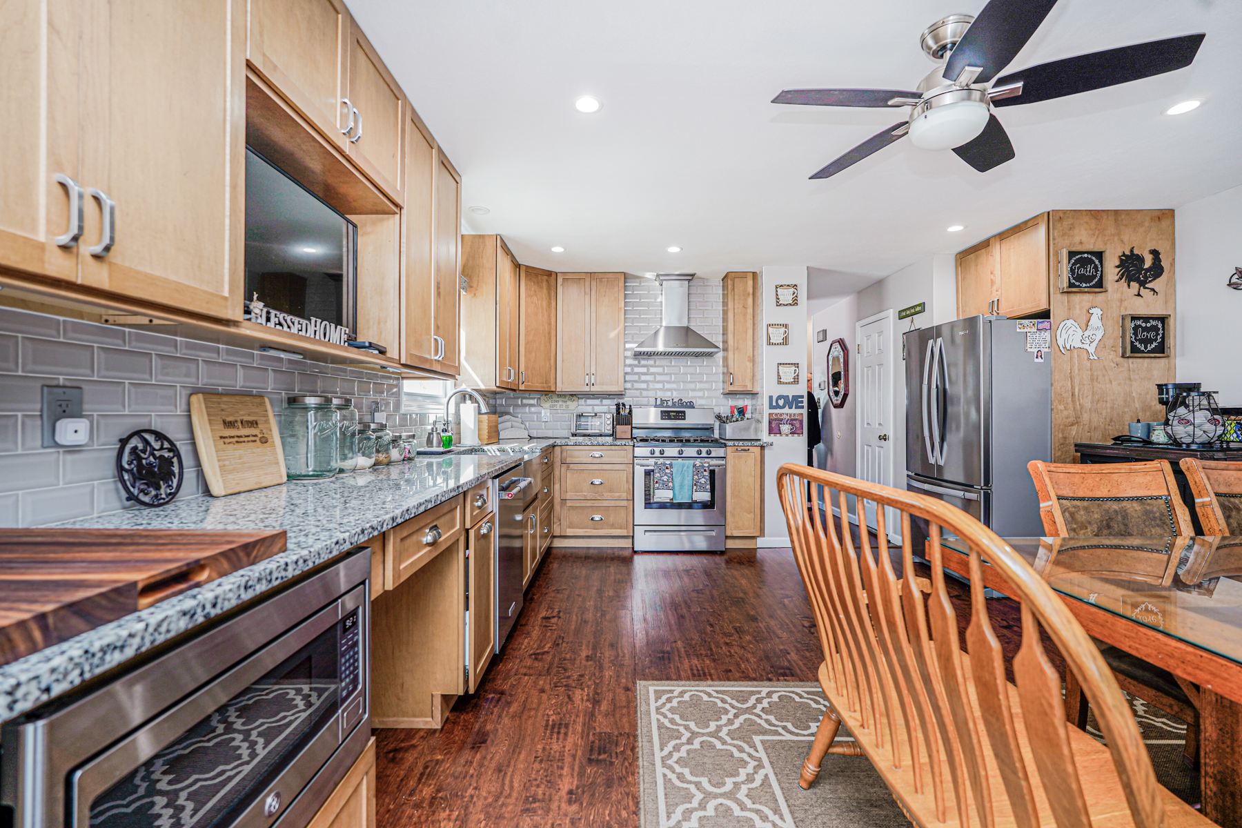 287 Greaves Avenue Staten Island, NY 10308 - Photo 8 of 35 a kitchen with stainless steel appliances granite countertop a stove a sink and a refrigerator
