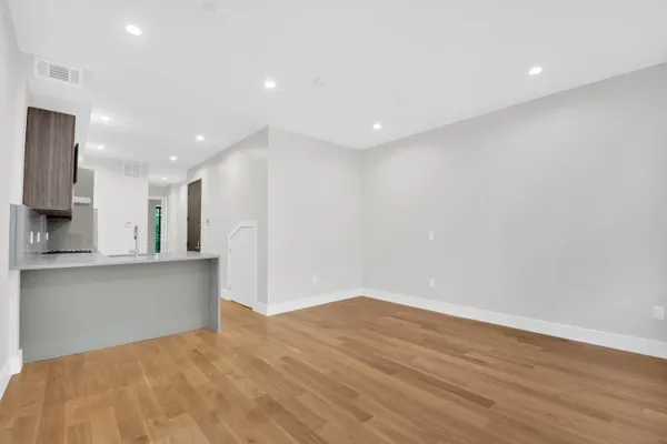 a view of kitchen with wooden floor