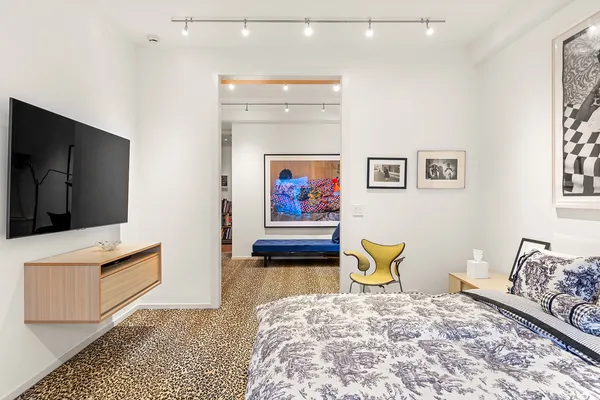 a bedroom with a bed and furniture