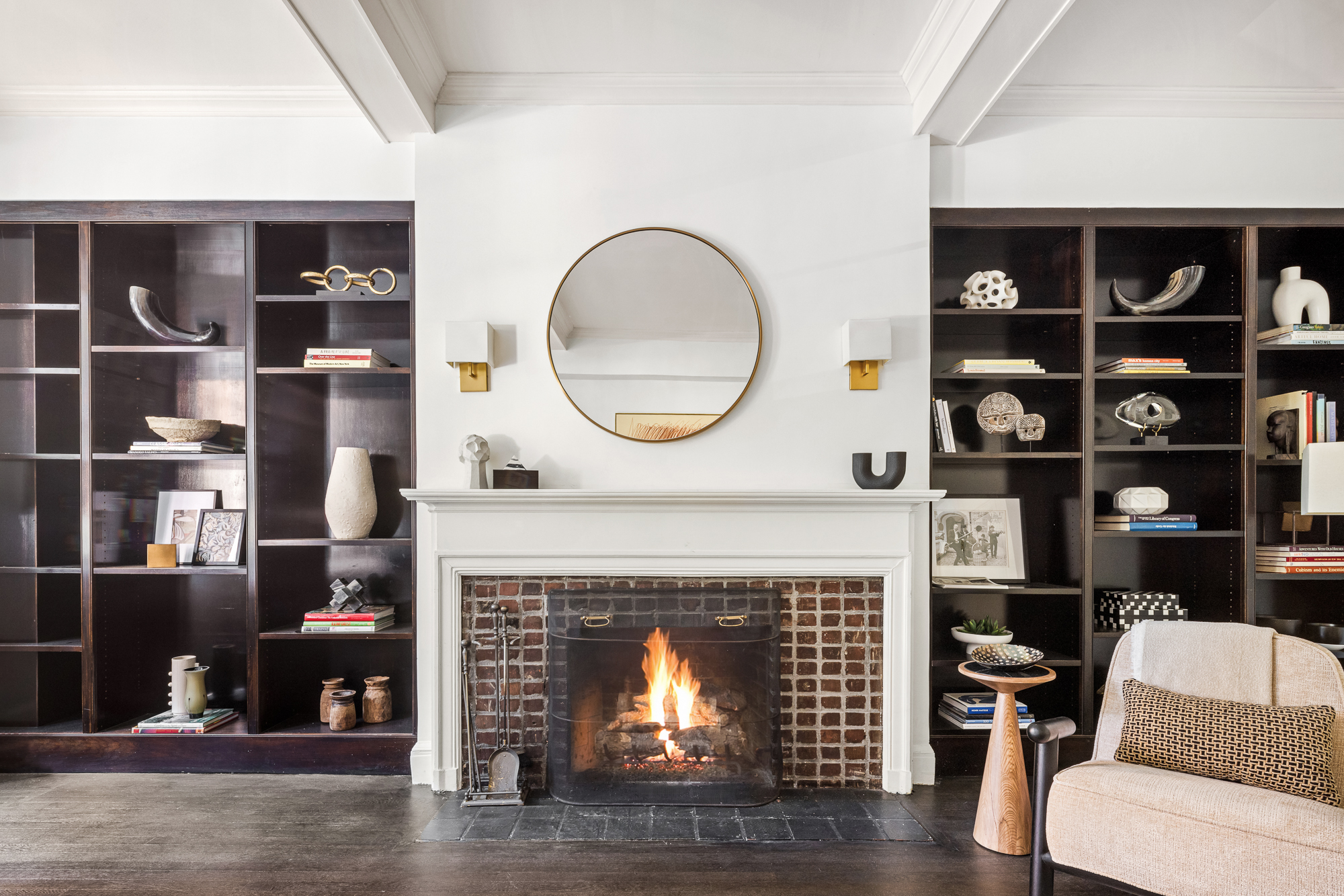 39 5th Avenue, Unit 2B Manhattan, NY 10003 - Photo 6 of 12 a living room with a fireplace and a wooden floor
