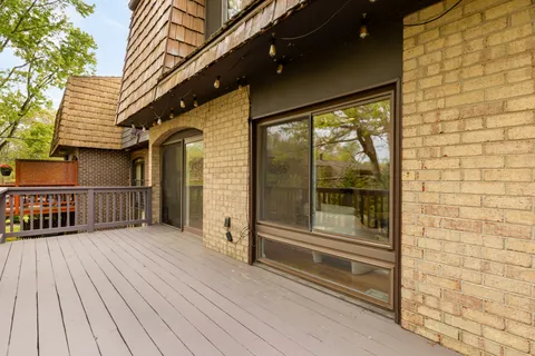 a living room with furniture and a lamp