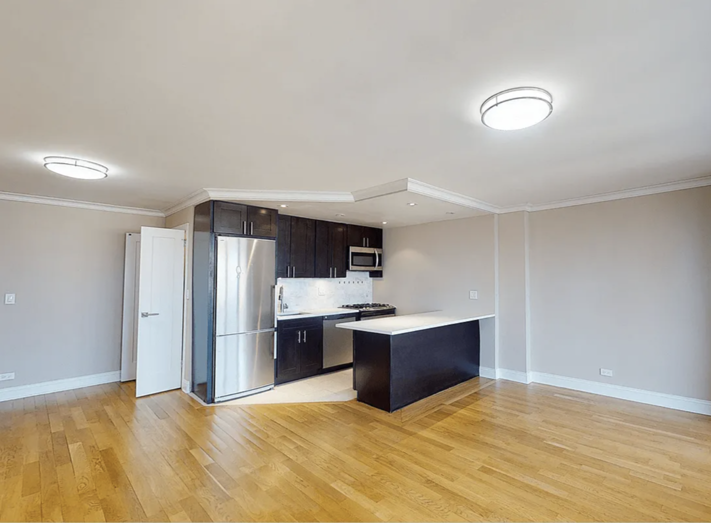 40 Harrison Street, Unit 24H Manhattan, NY 10013 - Photo 4 of 17 a view of kitchen and refrigerator