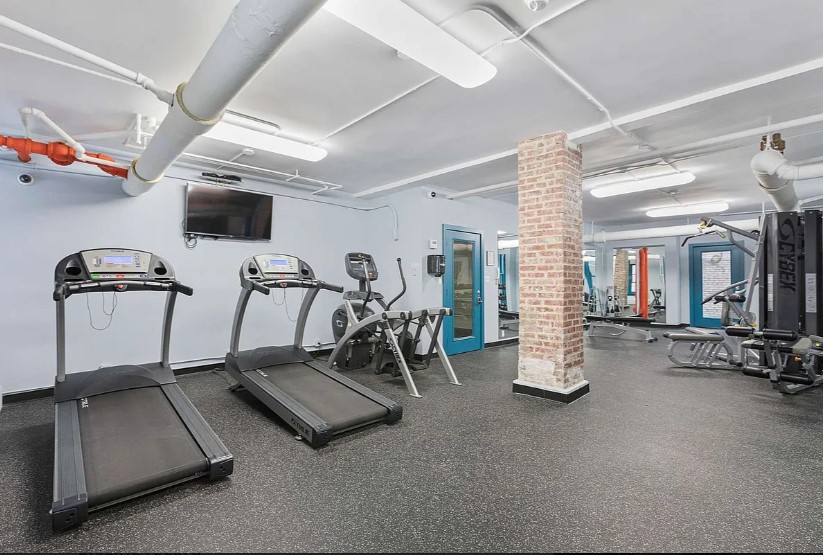 246 West End Avenue, Unit 9F Manhattan, NY 10023 - Photo 9 of 10 a view of a room with gym equipment