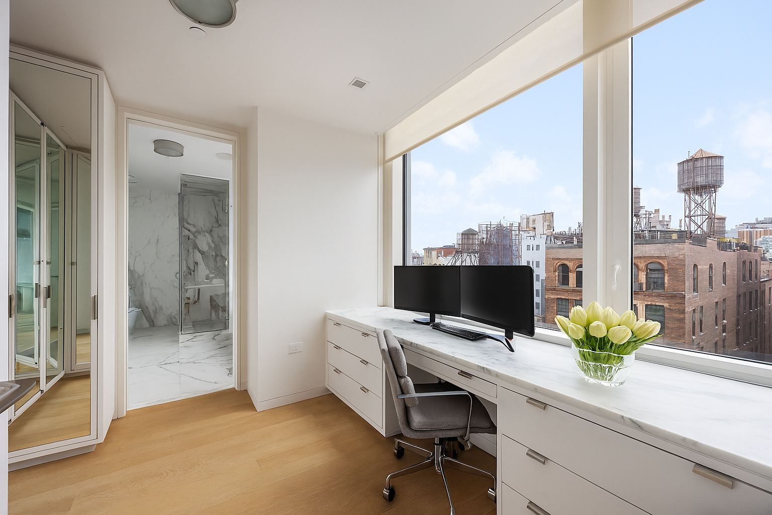 350 West Broadway, Unit 7 Manhattan, NY 10013 - Photo 9 of 17 a view of a workspace with a window