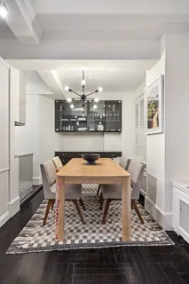 a dining room with a table and chairs