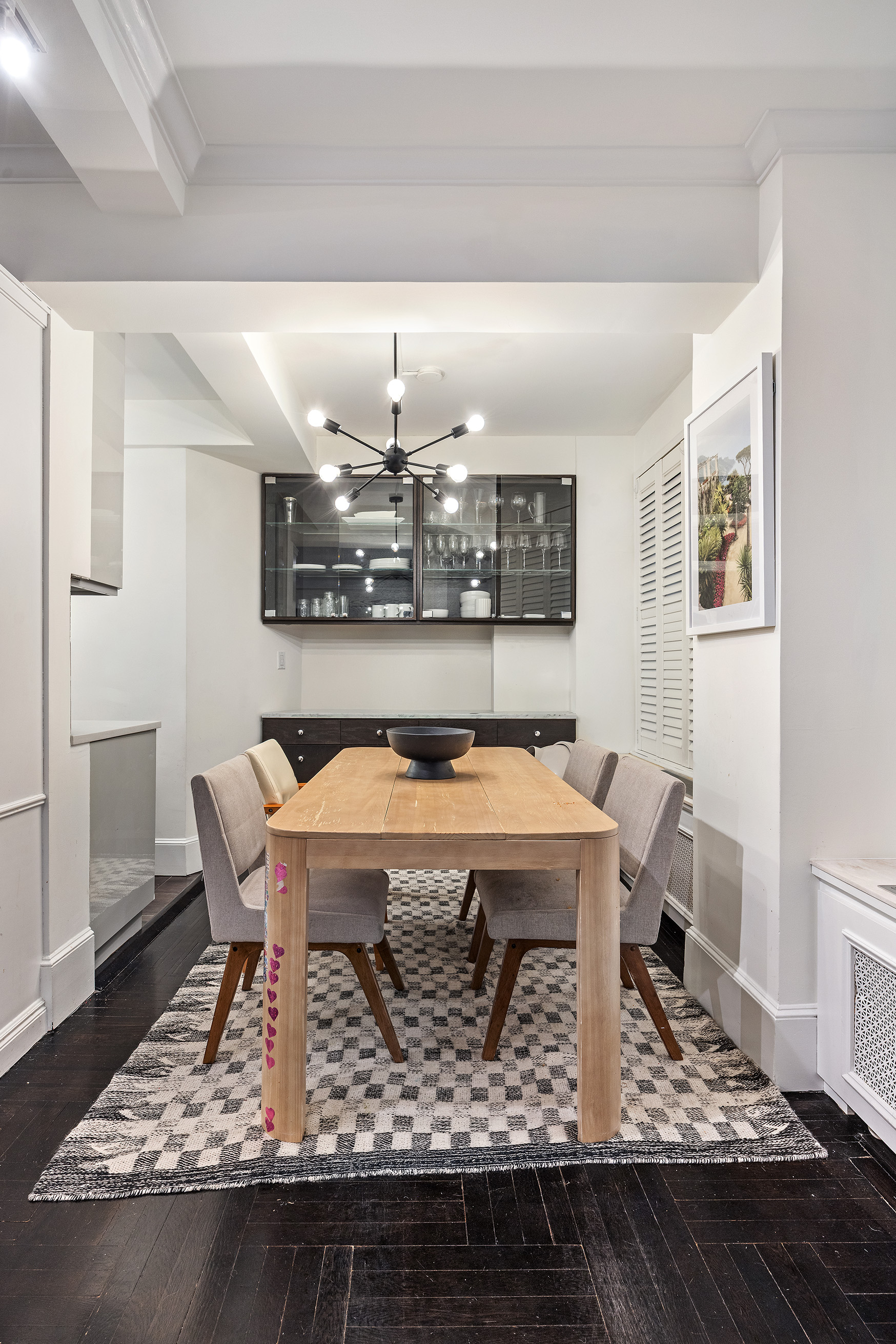 325 East 79th Street, Unit 6C Manhattan, NY 10075 - Photo 5 of 17 a dining room with a table and chairs