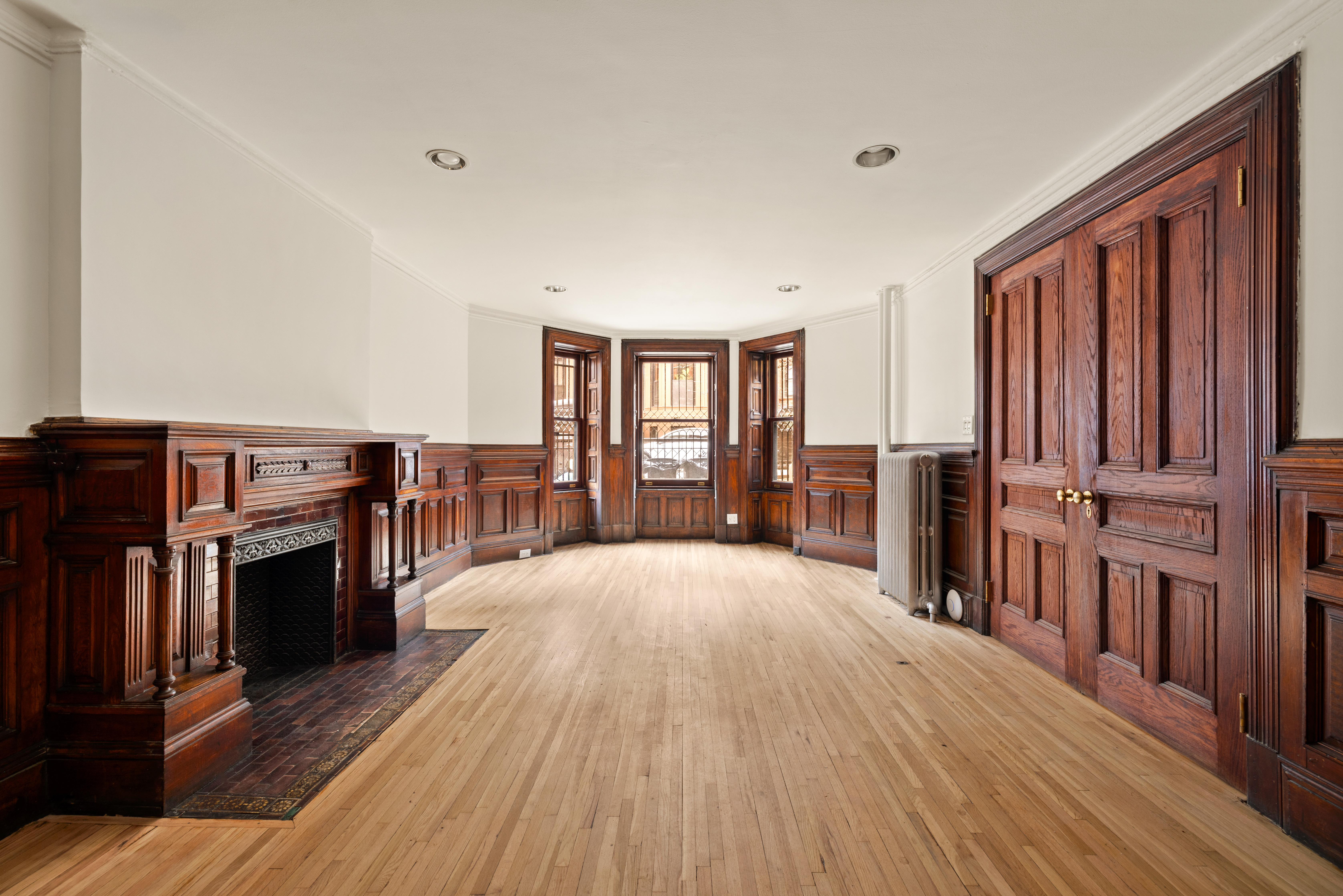 906 President Street, Unit 1 Brooklyn, NY 11215 - Photo 11 of 18 wooden floor in an empty room with a window