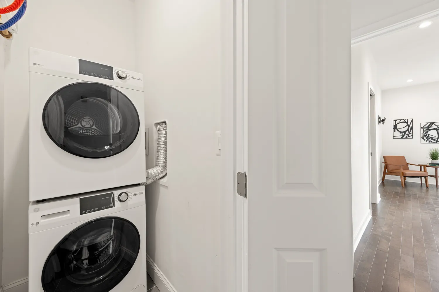 a view of a hallway with washer and dryer