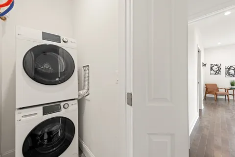 a view of a hallway with washer and dryer