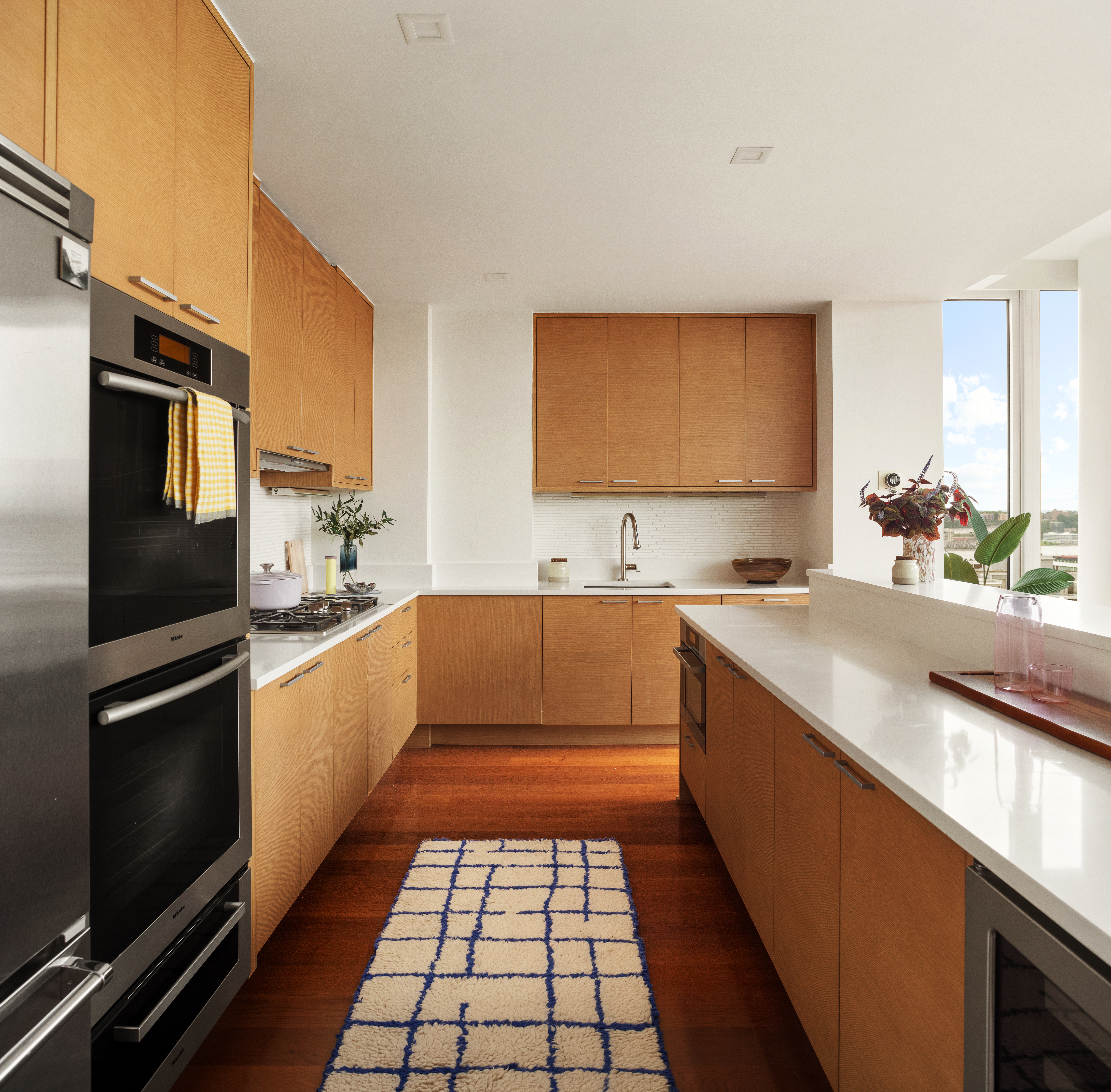 230 West 78th Street, Unit PH19 Manhattan, NY 10024 - Photo 8 of 17 a kitchen with a sink stove and microwave