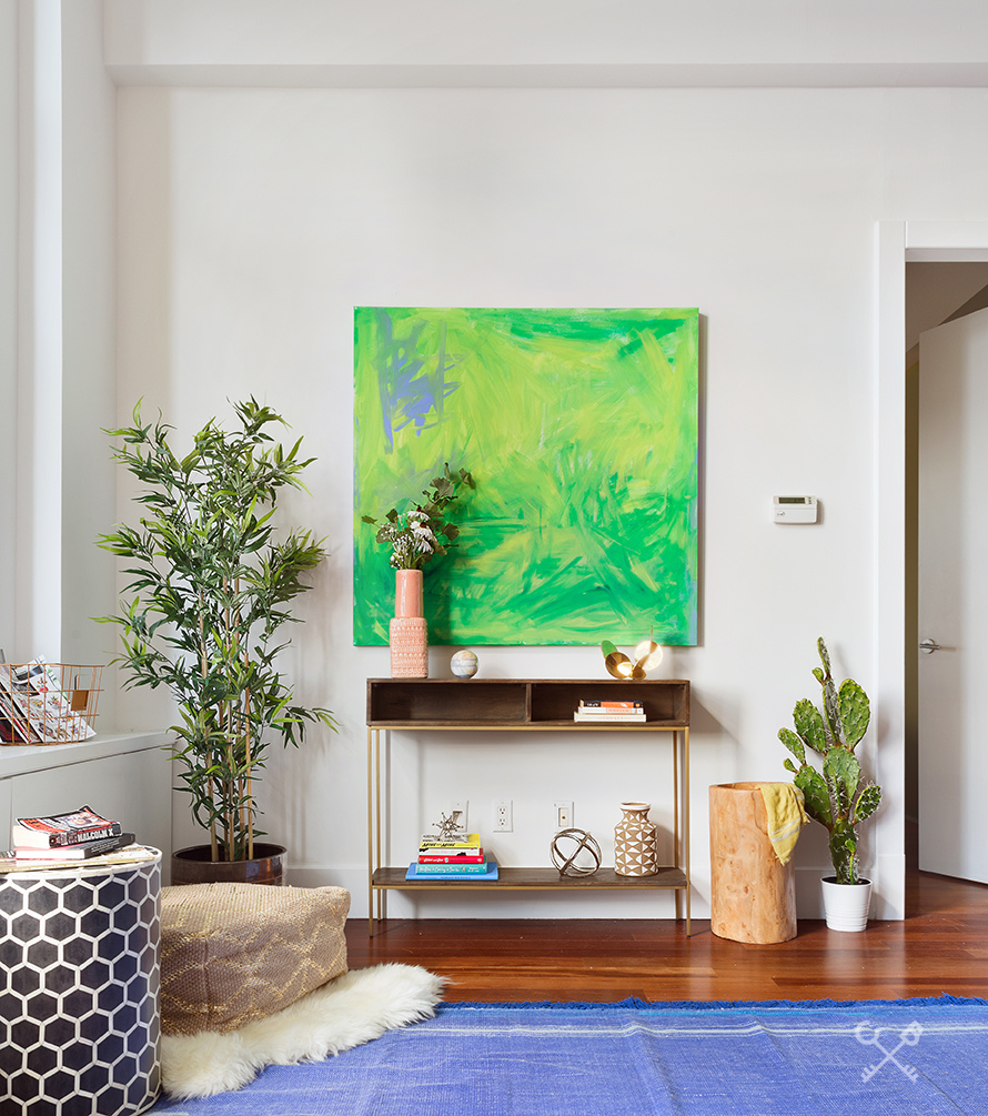 60 Broadway, Unit 10M Brooklyn, NY 11249 - Photo 4 of 12 a table with a potted plant sitting on top of it