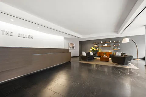 a view of a livingroom with furniture and a ceiling fan