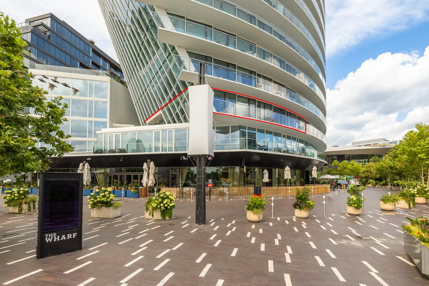 a front view of building with parking area