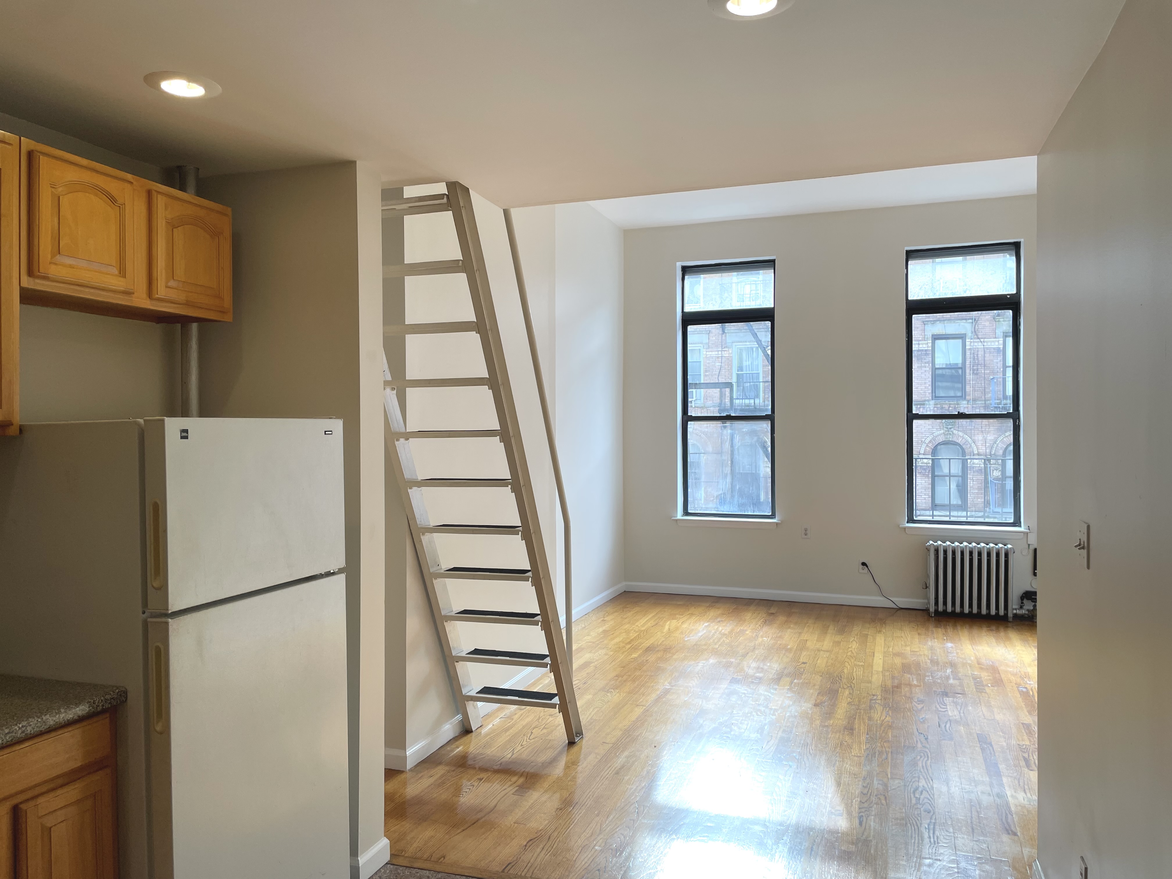 95 St Marks Place, Unit 6 Manhattan, NY 10009 - Photo 3 of 14 a view of kitchen with furniture and refrigerator