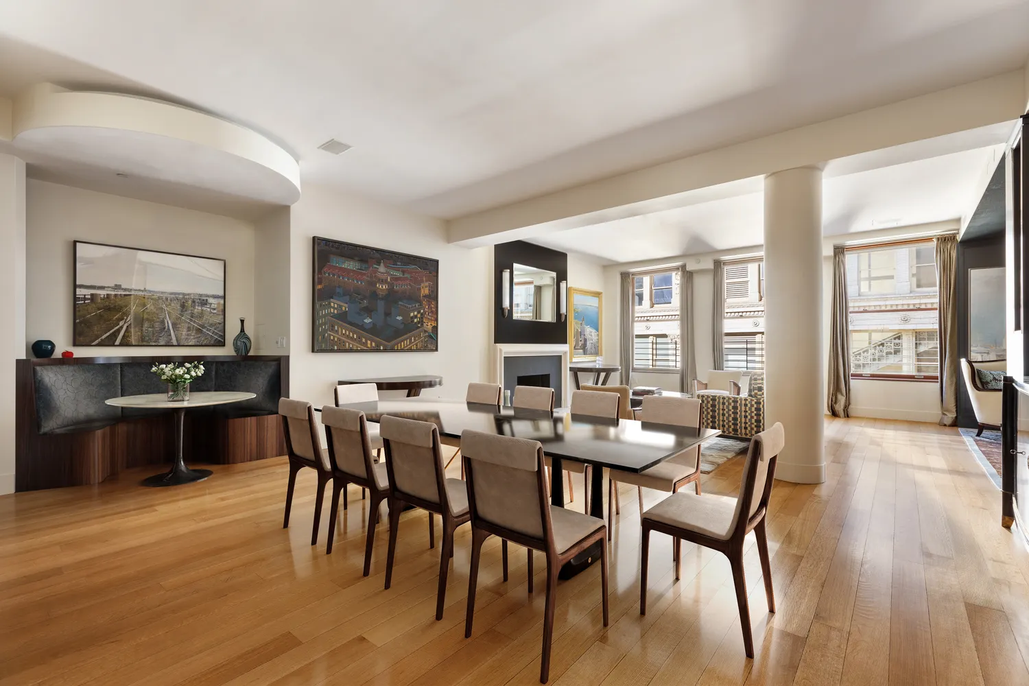 a view of a dining room with furniture window and wooden floor