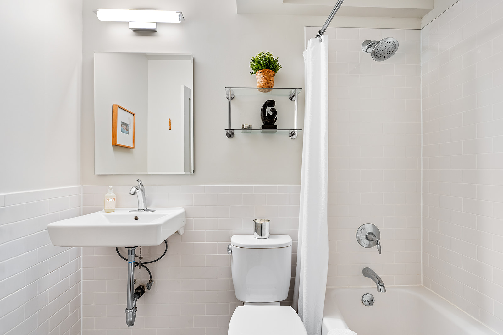 193 Clinton Avenue, Unit 9D Brooklyn, NY 11205 - Photo 7 of 11 a bathroom with a sink toilet and shower