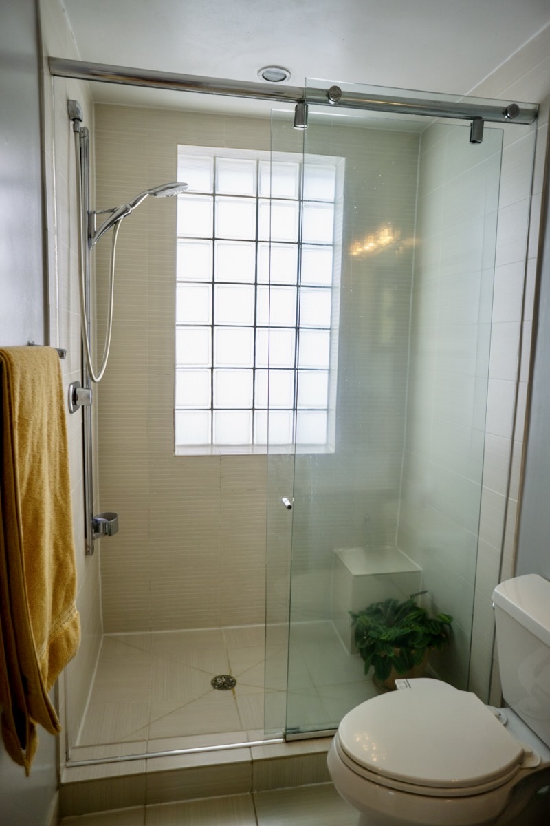 2426 Ontario Road Northwest, Unit 401 Washington, DC 20009 - Photo 16 of 28 a bathroom with a shower and a toilet
