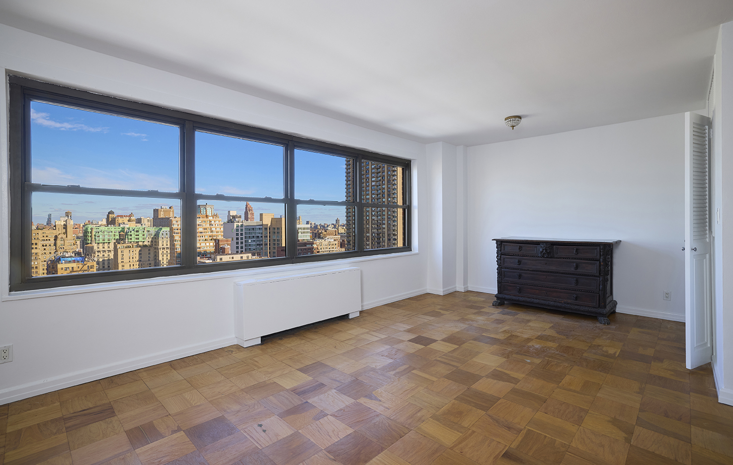 180 West End Avenue, Unit 27A Manhattan, NY 10023 - Photo 4 of 18 a view of an empty room with a window