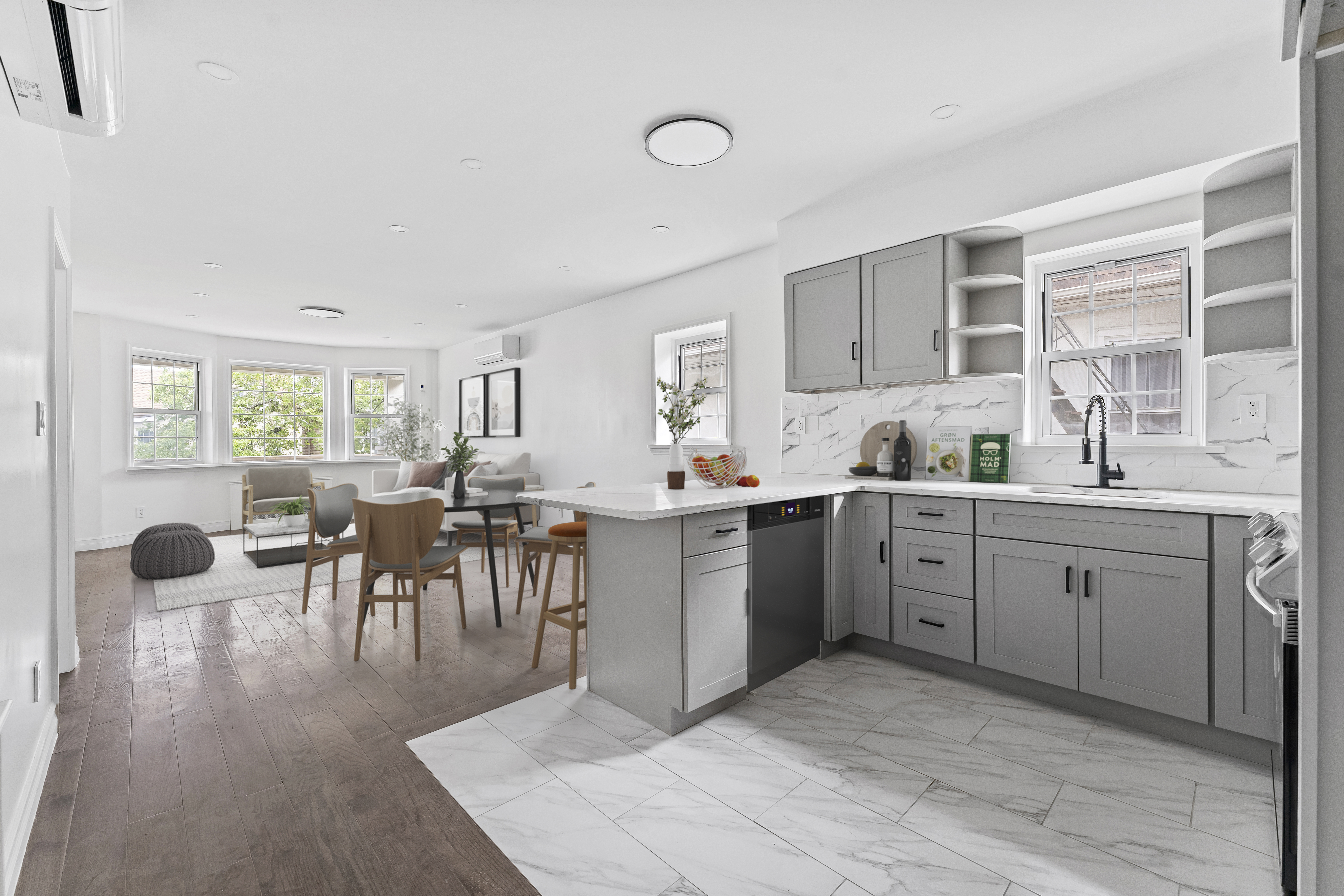 65 Bay 23rd Street, Unit 2 Brooklyn, NY 11214 - Photo 3 of 16 a kitchen with sink cabinets and dining table