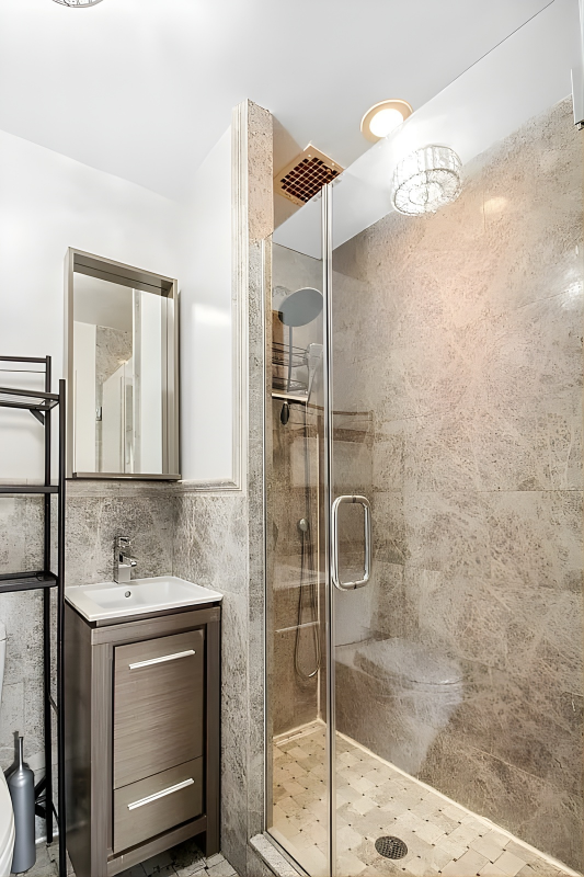 219 West 14th Street, Unit 4F Manhattan, NY 10011 - Photo 7 of 7 a bathroom with a shower and a sink