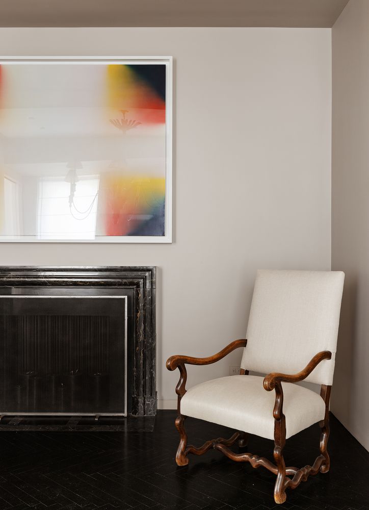 a view of a room with wooden floor and chair