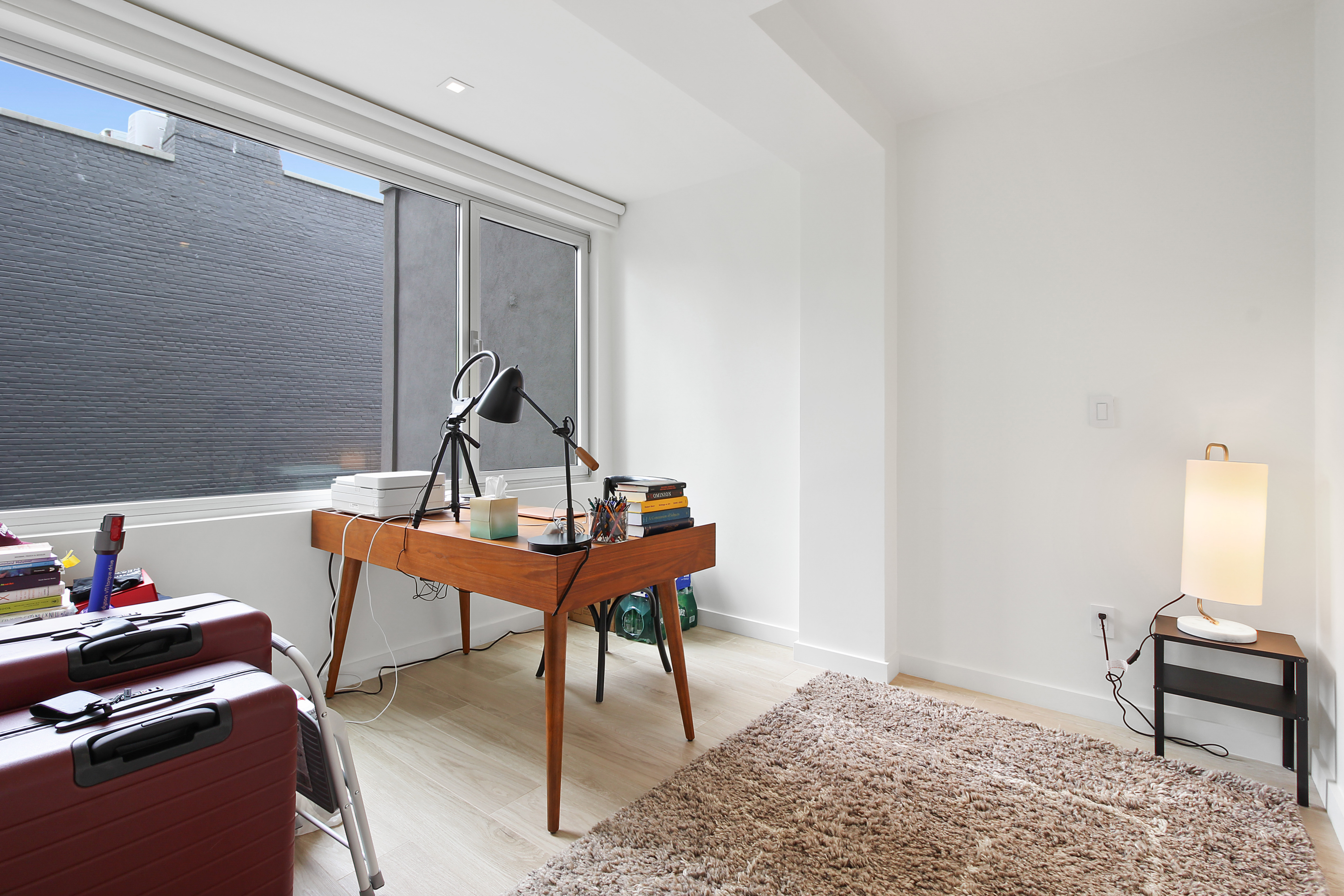 136 West Houston Street, Unit 4 Manhattan, NY 10012 - Photo 8 of 14 a reading room with furniture and a wooden floor