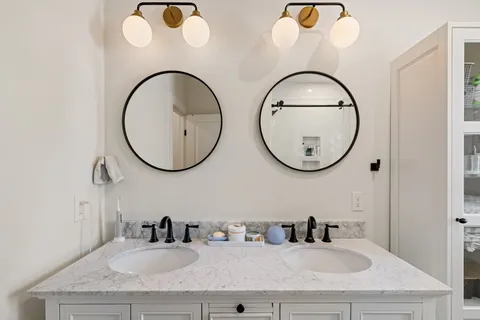 a view of room with cabinets and wooden floor