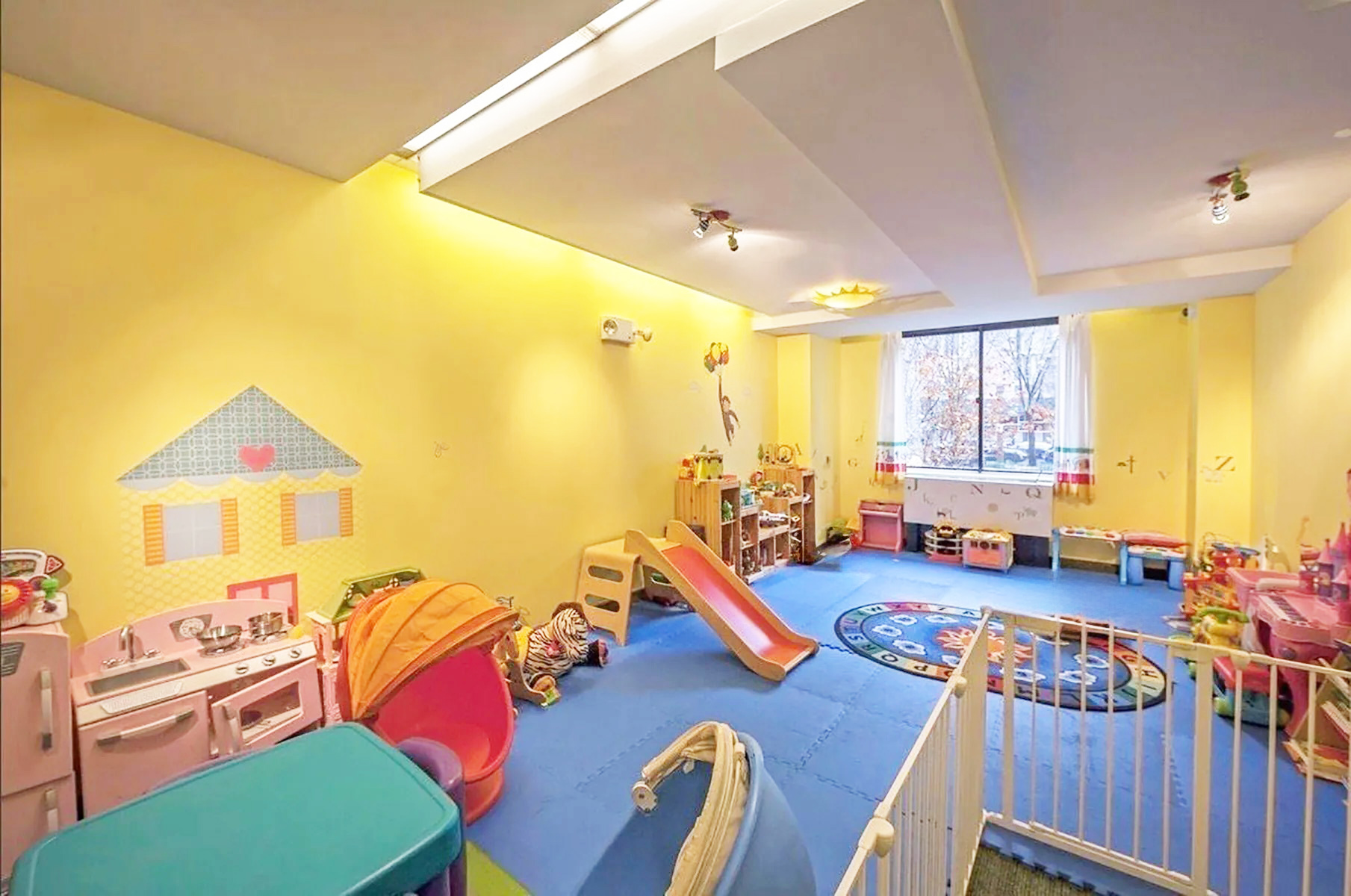 300 Rector Place, Unit 4E Manhattan, NY 10280 - Photo 6 of 9 a view of a dining room with furniture a chandelier and a flat screen tv