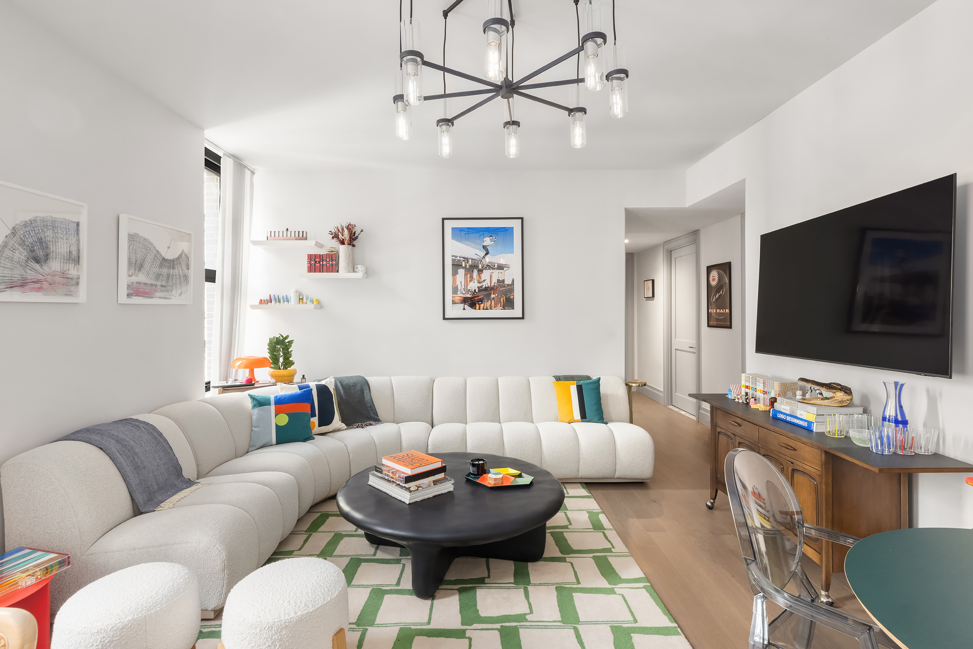 76 Schermerhorn Street, Unit 4C Brooklyn, NY 11201 - Photo 2 of 10 a living room with furniture and a flat screen tv