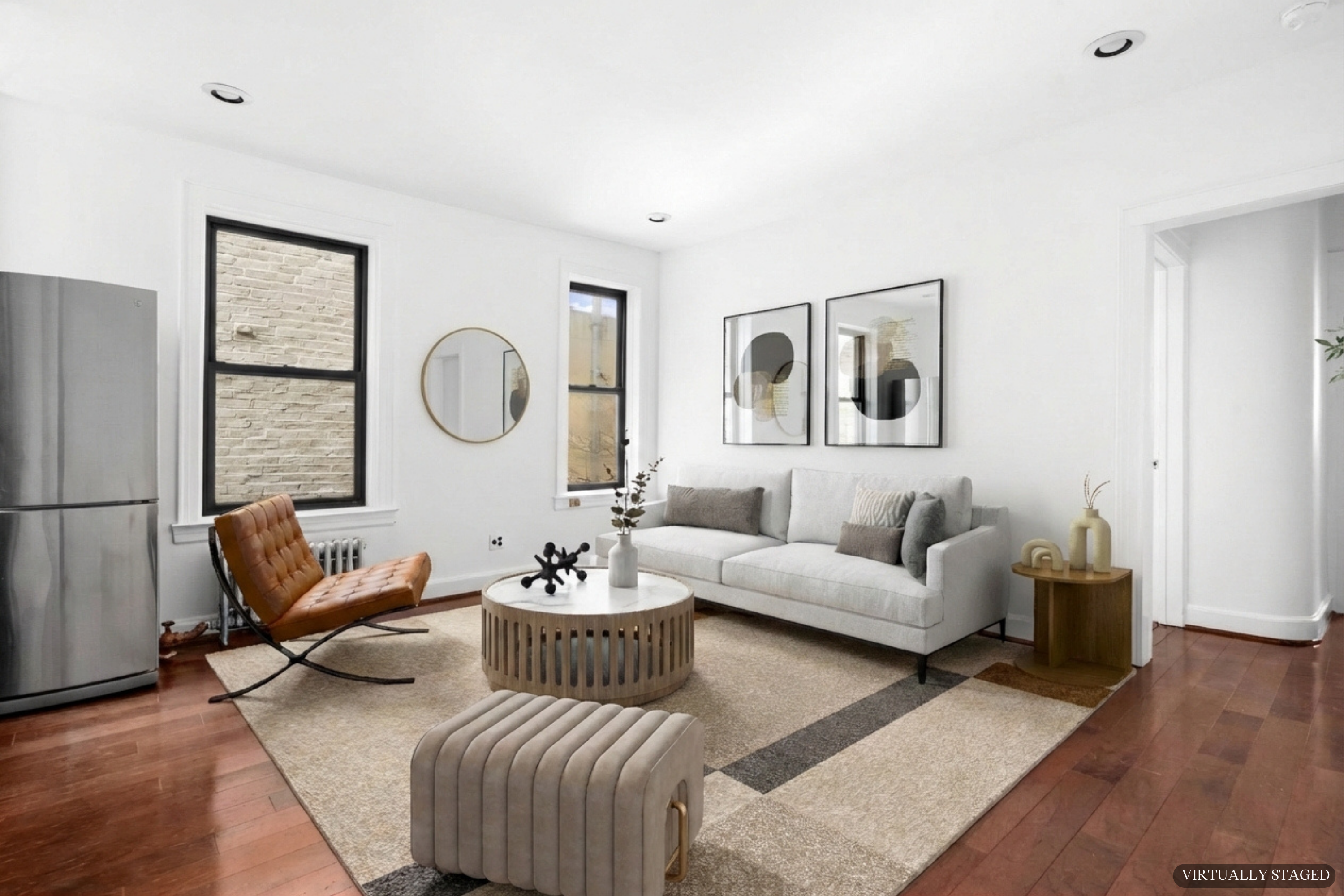 199 East 7th Street, Unit 4E Manhattan, NY 10009 - Photo 5 of 13 a living room with furniture rug and wooden floor