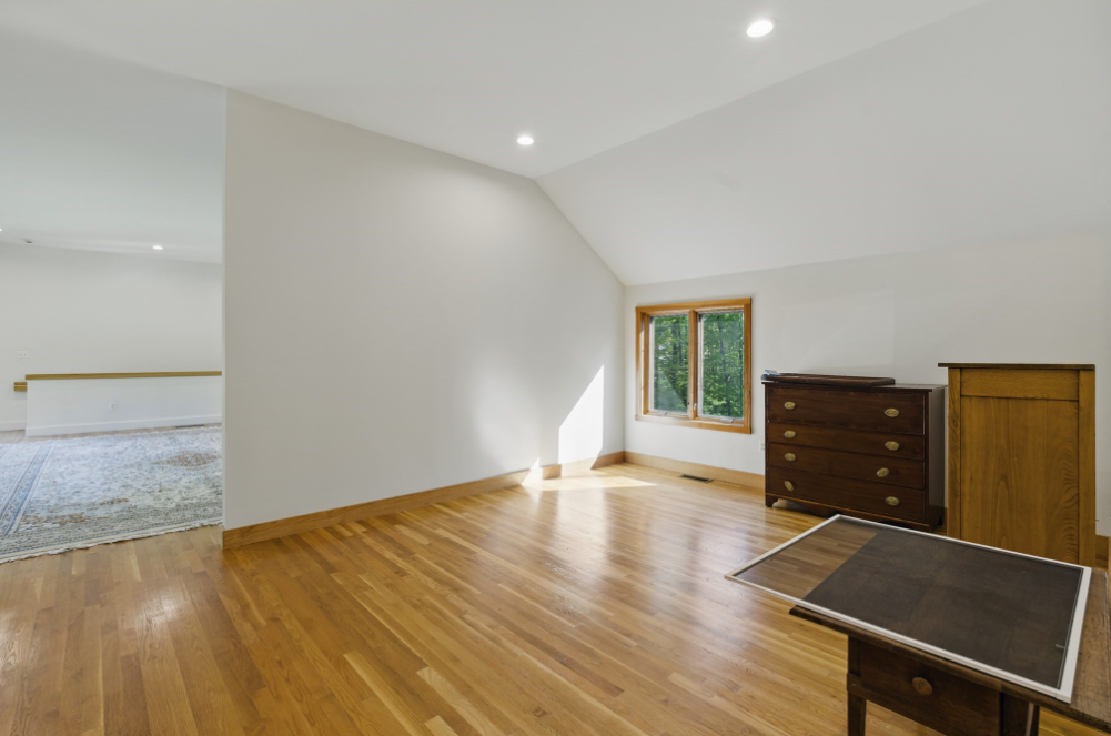 38 Gray Road Andover, MA 01810 - Photo 16 of 28 a view of an empty room with wooden floor and a window