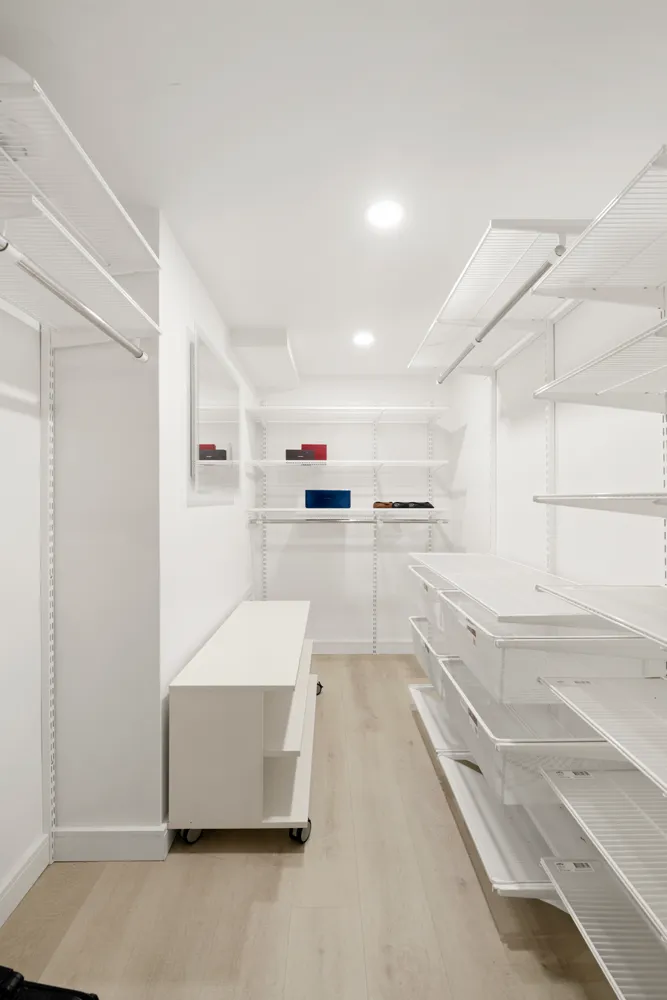 a kitchen with cabinets and white appliances