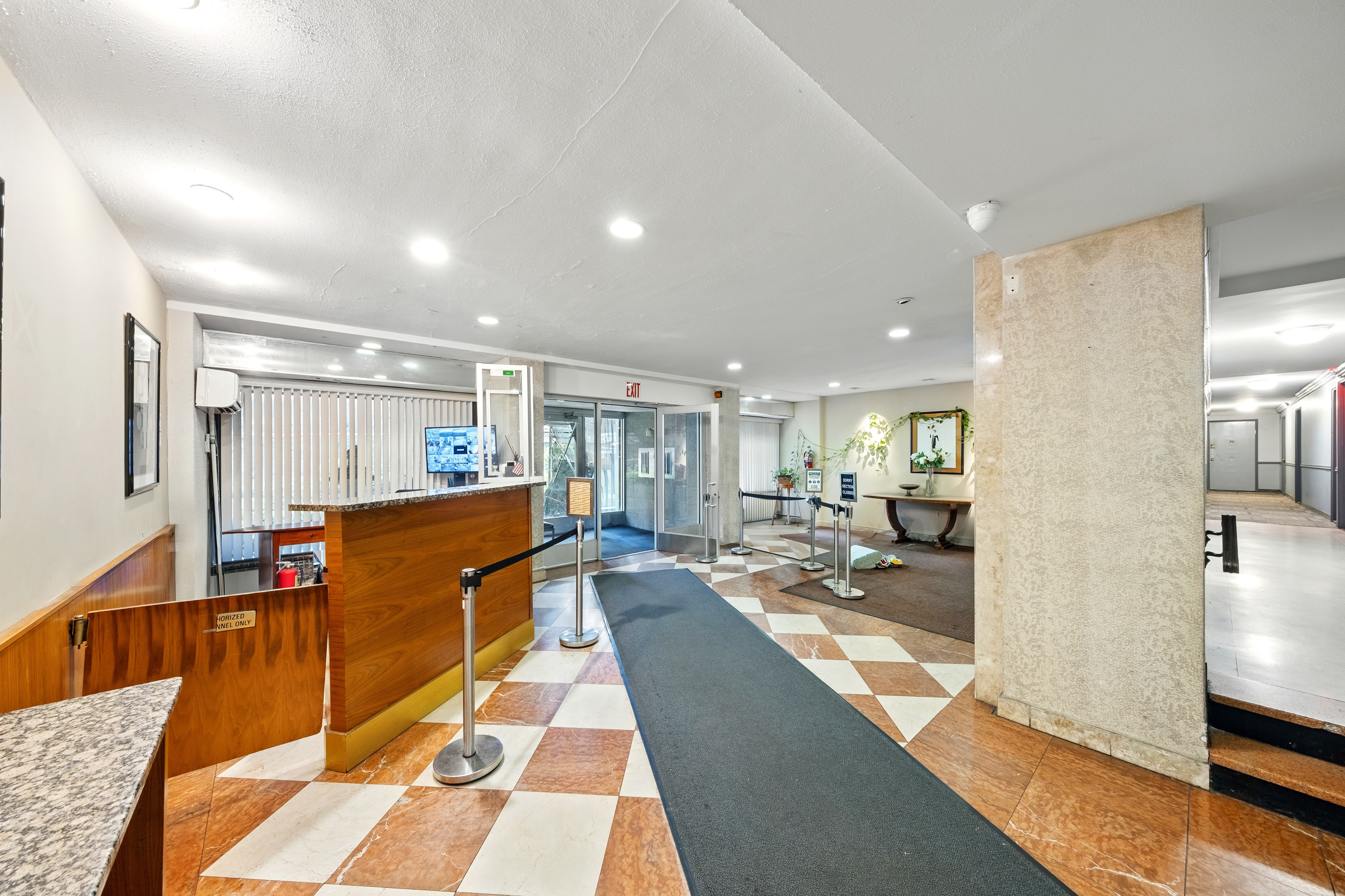 1360 Ocean Parkway, Unit 7B Brooklyn, NY 11230 - Photo 11 of 14 a living room with furniture a rug kitchen view and a large window